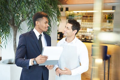 discussing-the-menu-at-the-restaurant-NMH9ZKB