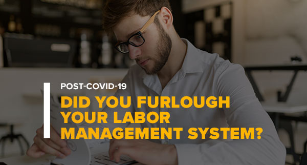 Man Reviewing Product Charts With Text: Post-Covid-19 Did You Furlough Your Labor Management System?