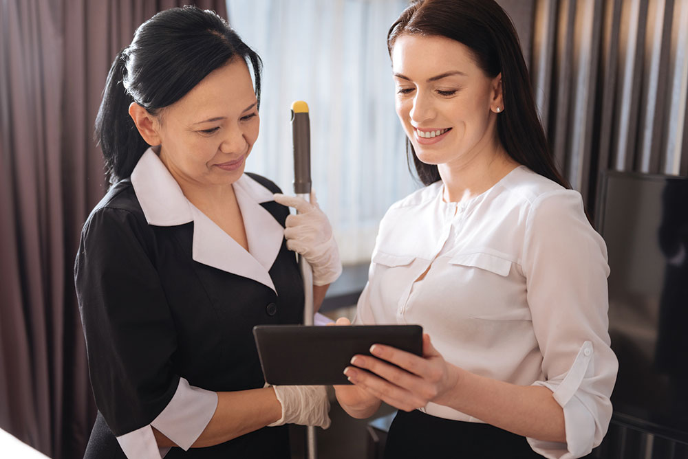 Hotel Staff Going Over Survey and Performance Reviews With Management